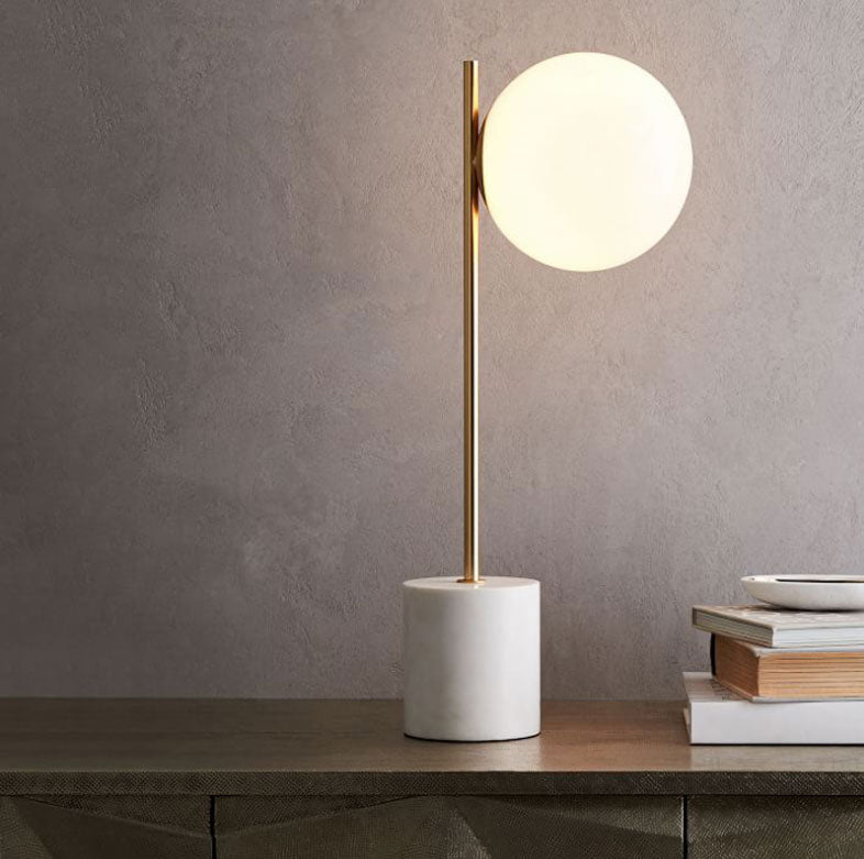 Modernist Marble gold table light with glass sphere