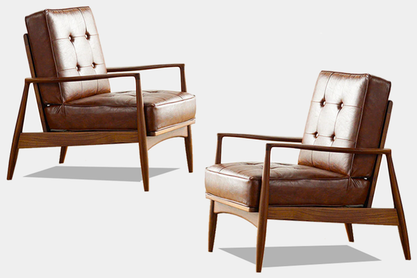 Danish style solid wood lounge chairs with patinated upholstery